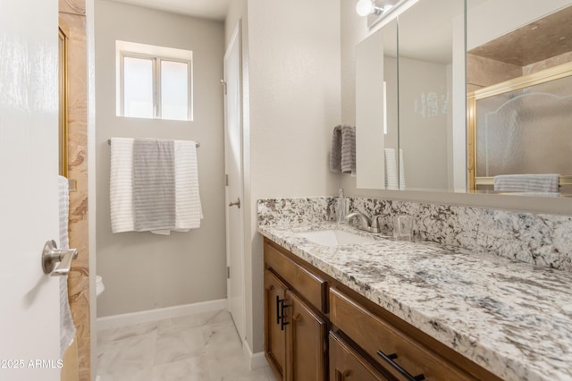 bathroom with vanity and an enclosed shower