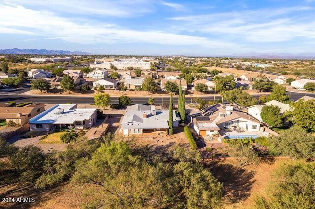 birds eye view of property featuring a mountain view