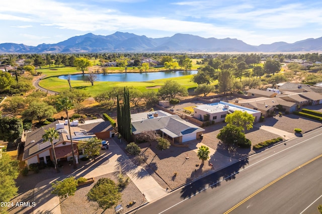 birds eye view of property featuring a water and mountain view