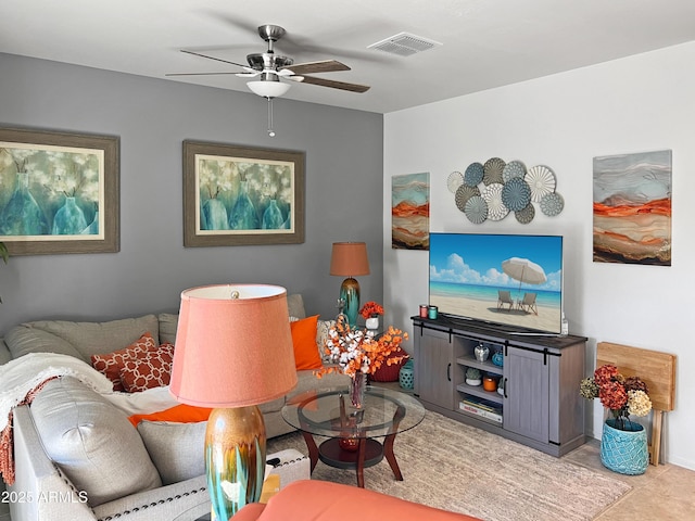 tiled living room featuring ceiling fan