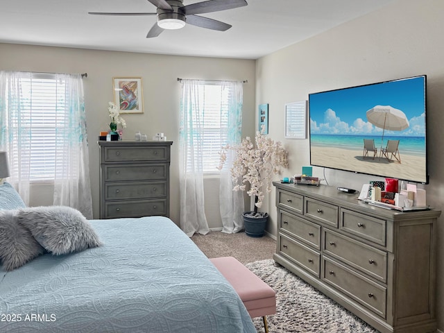 bedroom featuring ceiling fan and light colored carpet