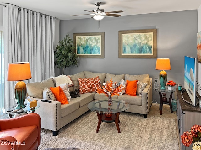 living room featuring light carpet and ceiling fan