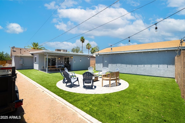 1531 S Padre Rd, Apache Junction, AZ 85119 - rear view of house with a patio, a lawn, a fire pit, and stucco siding