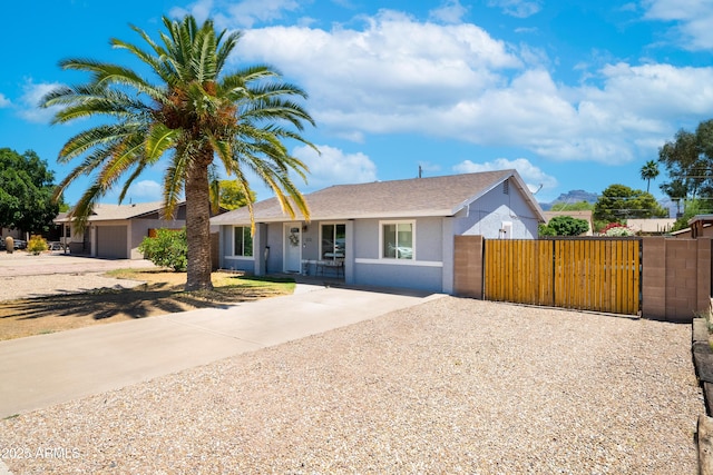 1531 S Padre Rd, Apache Junction, AZ 85119 - single story home with driveway, a gate, stucco siding, and roof with shingles
