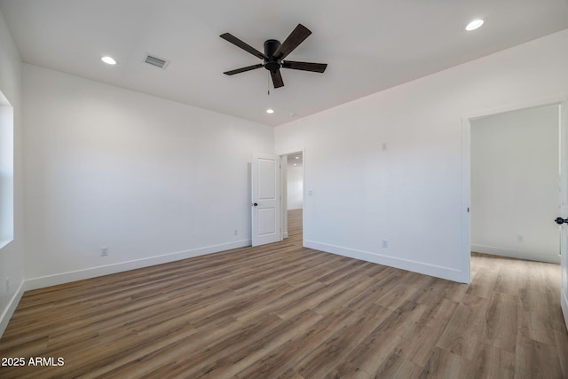 unfurnished room featuring ceiling fan and light wood-type flooring