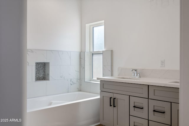 bathroom featuring vanity and a tub