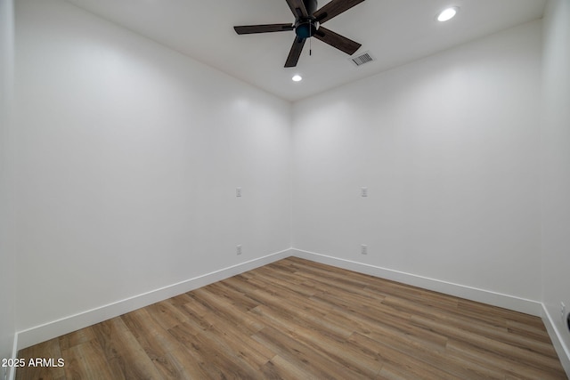 spare room featuring ceiling fan and hardwood / wood-style floors