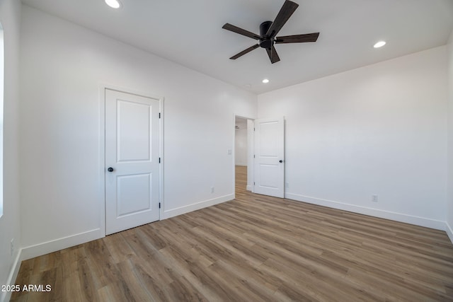 unfurnished bedroom featuring ceiling fan and light hardwood / wood-style flooring