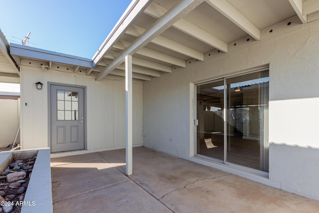 entrance to property with a patio