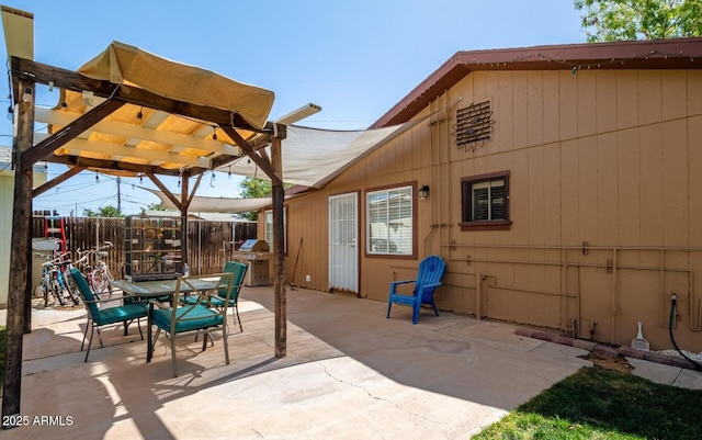 view of patio / terrace featuring outdoor dining area, fence, area for grilling, and a pergola