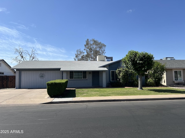 ranch-style home with driveway and a front yard