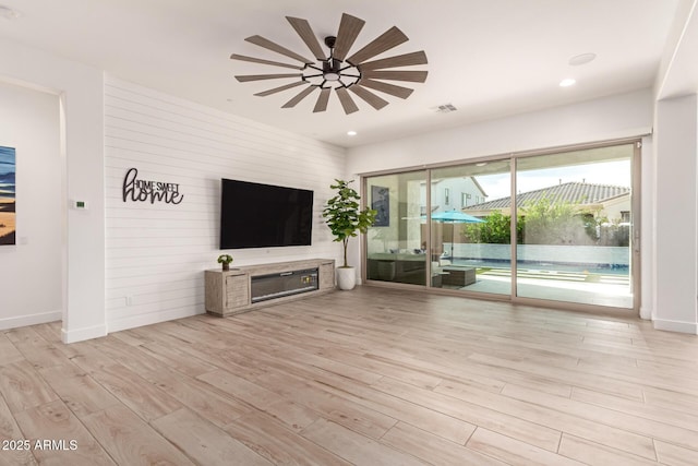 2316 E Canary Dr, Gilbert, AZ 85297 - unfurnished living room with wood finished floors, a ceiling fan, baseboards, and recessed lighting