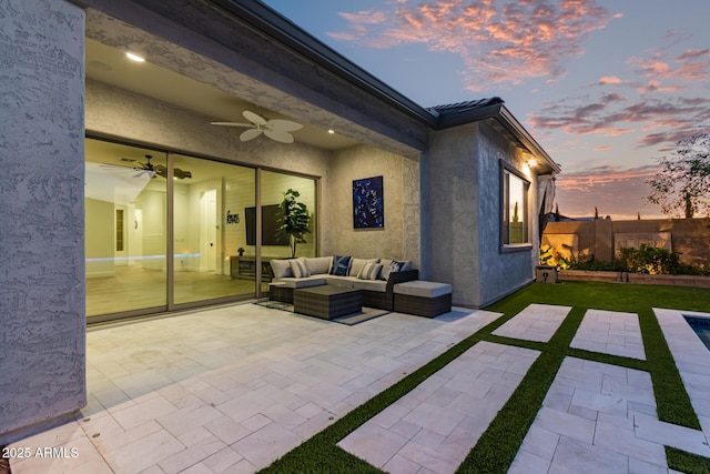 2316 E Canary Dr, Gilbert, AZ 85297 - patio terrace at dusk with a patio area, an outdoor living space, and a ceiling fan