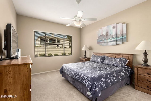 bedroom featuring ceiling fan and light colored carpet