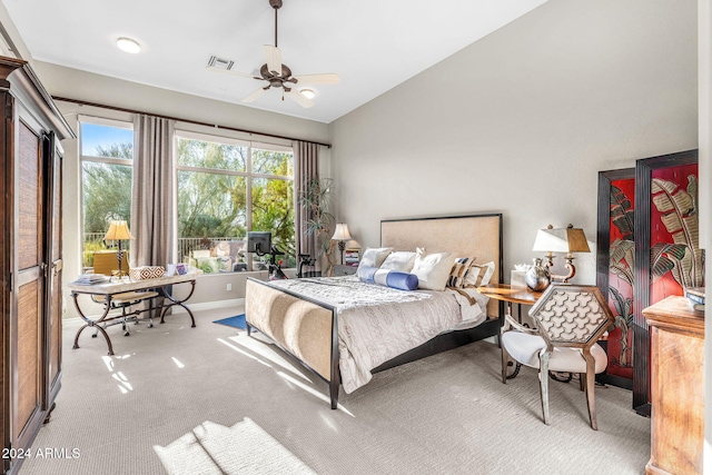 bedroom featuring ceiling fan and light colored carpet