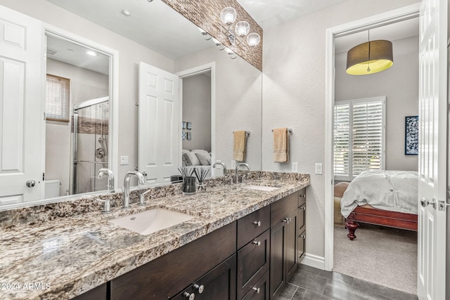 bathroom featuring vanity, toilet, and walk in shower