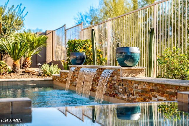 view of pool featuring pool water feature