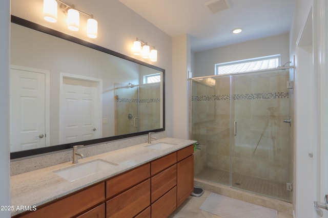 bathroom with vanity, tile patterned flooring, and a shower with door