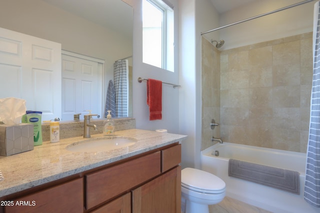 full bathroom featuring toilet, vanity, and shower / tub combo with curtain