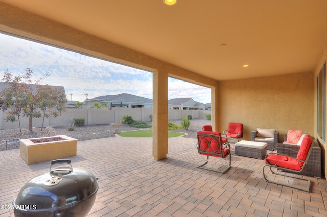 view of patio with an outdoor fire pit