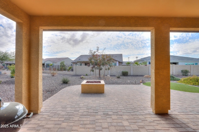 view of patio / terrace with an outdoor fire pit