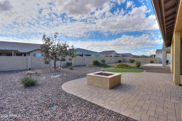 view of patio / terrace featuring a fire pit