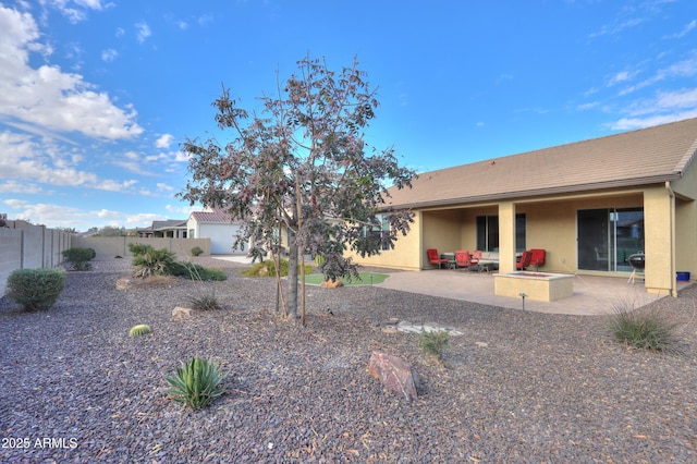 back of property featuring a patio