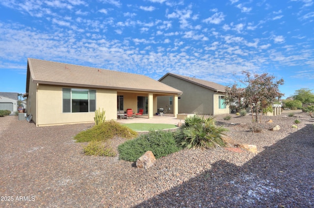 back of property featuring a patio