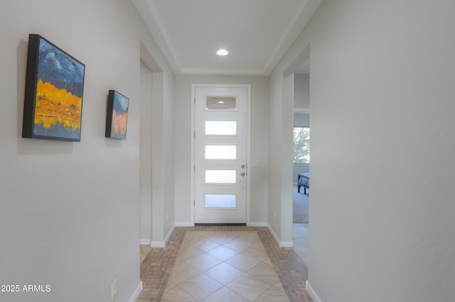 doorway with light tile patterned floors