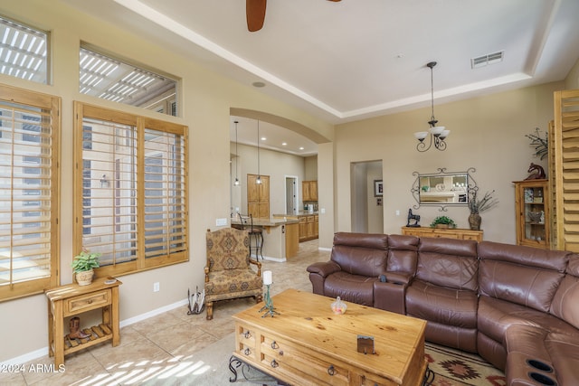 living room featuring ceiling fan and light tile patterned flooring