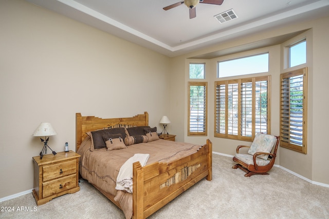 bedroom featuring light carpet and ceiling fan