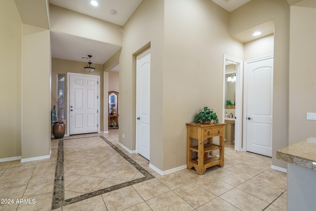 foyer entrance with light tile patterned floors