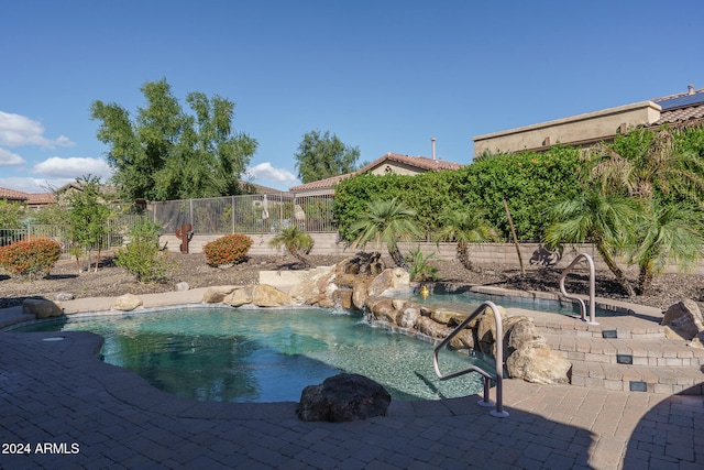 view of swimming pool featuring pool water feature