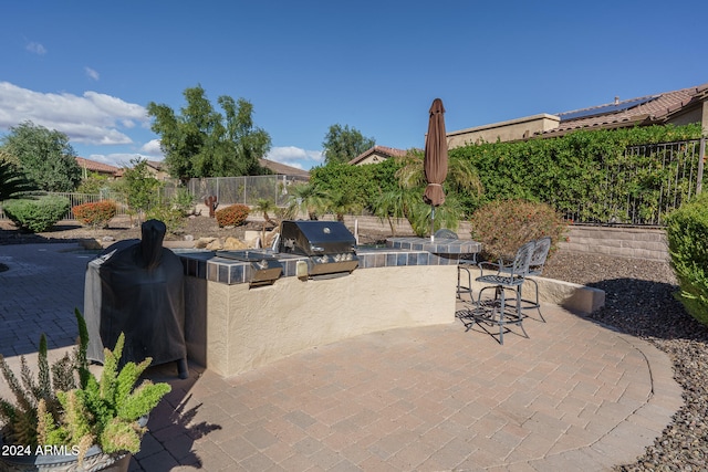 view of patio / terrace with area for grilling and an outdoor kitchen