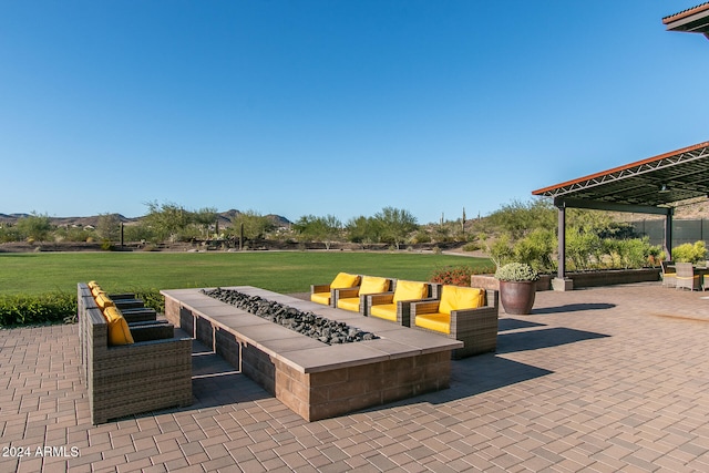 view of patio / terrace featuring an outdoor fire pit