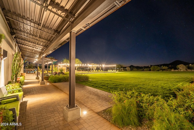 patio at night with a lawn