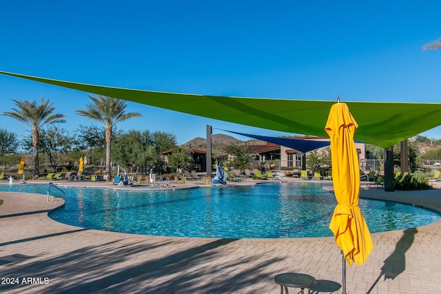 view of swimming pool featuring a patio