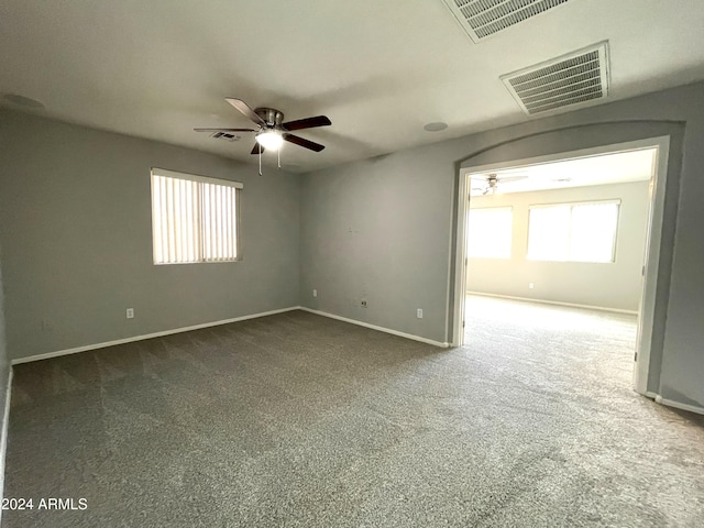 carpeted empty room with ceiling fan