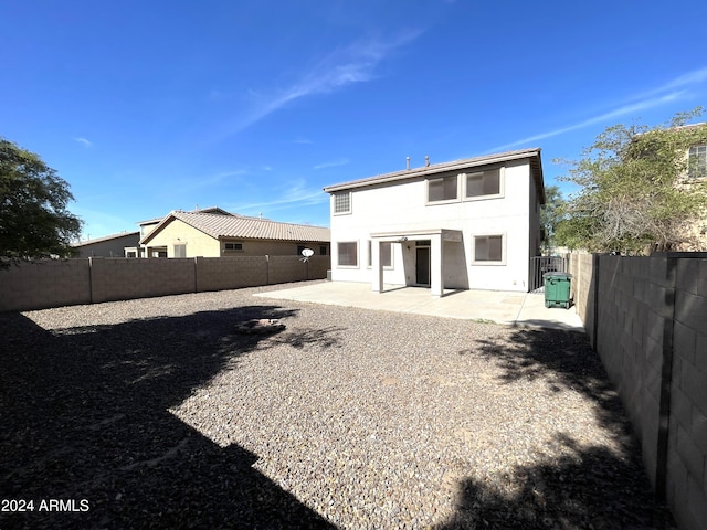 rear view of house featuring a patio