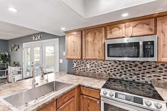 6408 W College Dr, Phoenix, AZ 85033 - kitchen with sink, backsplash, and stainless steel appliances
