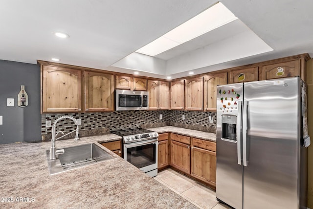 6408 W College Dr, Phoenix, AZ 85033 - kitchen with sink, decorative backsplash, stainless steel appliances, and light tile patterned flooring