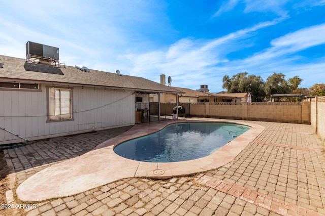 6408 W College Dr, Phoenix, AZ 85033 - view of swimming pool with central AC and a patio