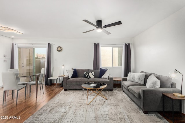 living room with ceiling fan and wood finished floors