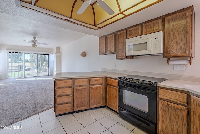 kitchen with black electric range, light carpet, a textured ceiling, and ceiling fan