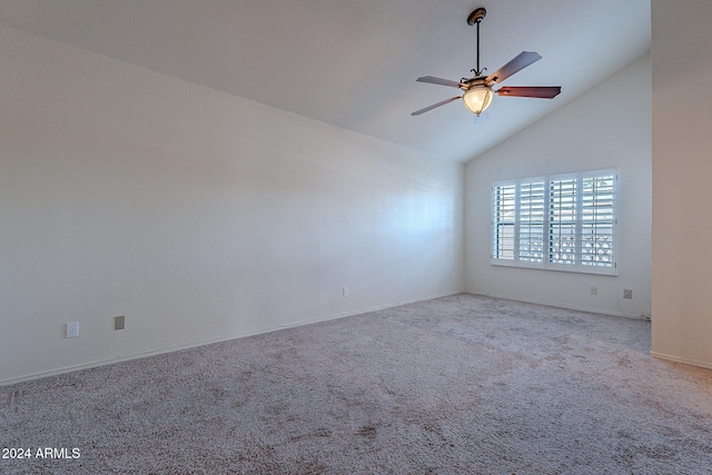 spare room featuring light carpet, high vaulted ceiling, and ceiling fan