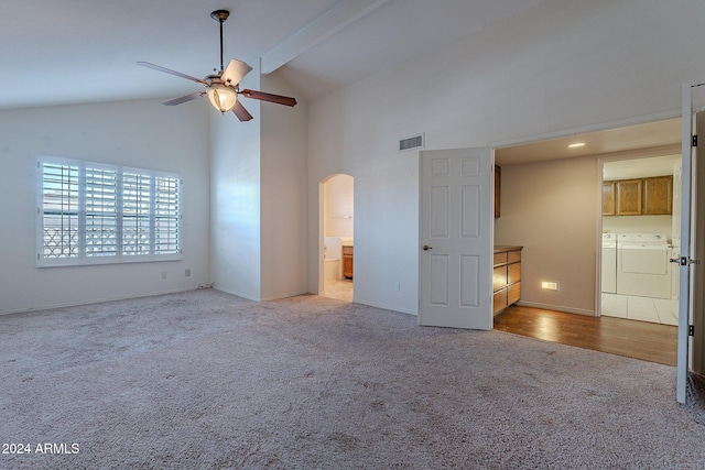 unfurnished living room featuring beam ceiling, ceiling fan, high vaulted ceiling, light hardwood / wood-style floors, and washer and clothes dryer