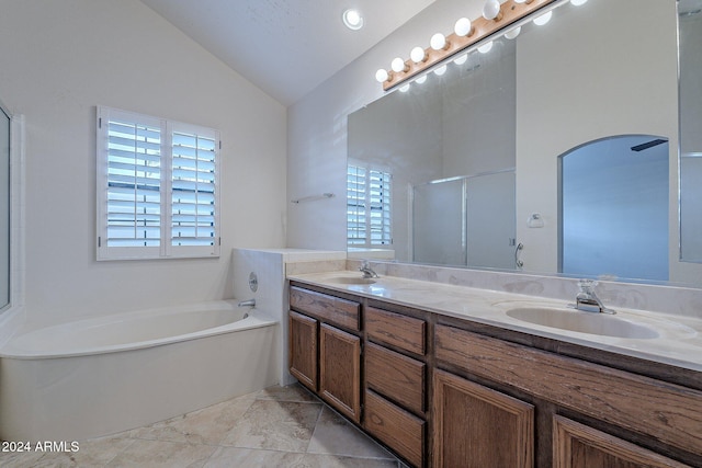 bathroom featuring plus walk in shower, plenty of natural light, vanity, and lofted ceiling