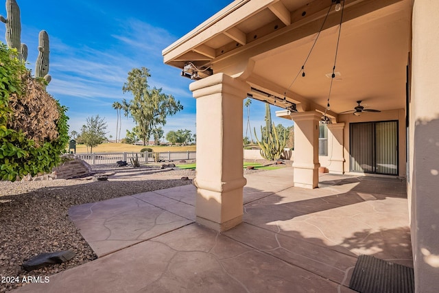 view of patio featuring ceiling fan