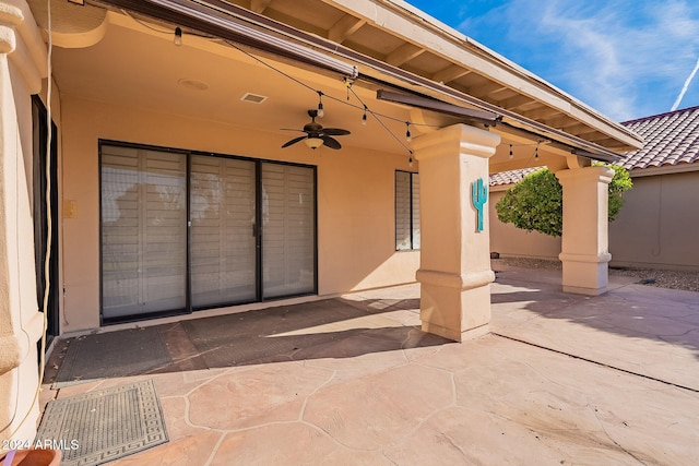 view of patio featuring ceiling fan