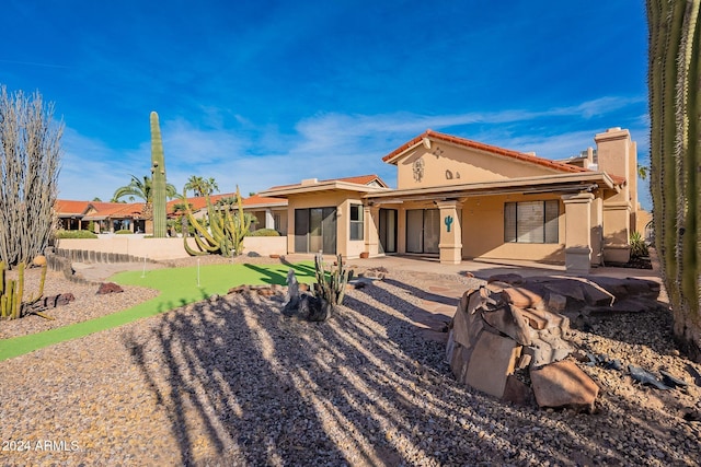 rear view of house with a patio